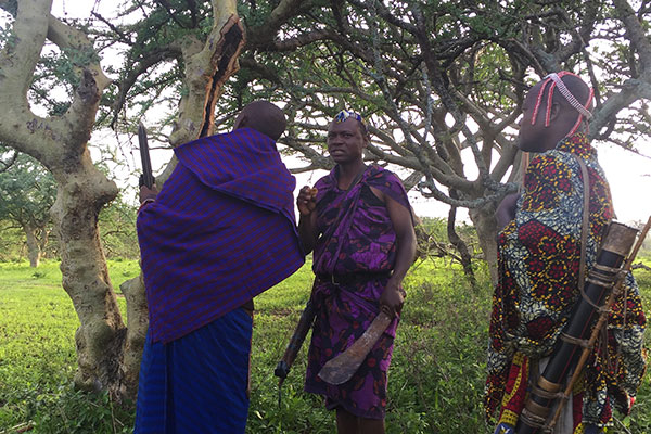 Luxury Africa Travel Specialists - Laura Tober - Walking Safari with Maasai in Tanzania - Safari Guides Finding Local Honey